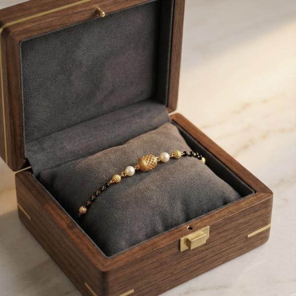 Elegant Black Bead Gold Bracelet with Pearl Detailing